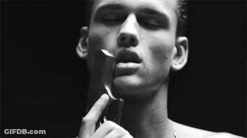 Man Holding Gun To Face GIF