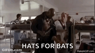 Man Holding Hammer In Room With Bunk Beds GIF