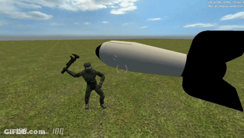 Man Holding Hammer Next To Missile GIF