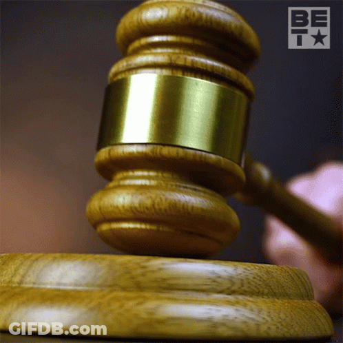 Man Holding Hammer Over Yellow Object GIF