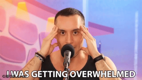 Man Holding Head At Microphone Saying I Was Getting Overwhelmed GIF