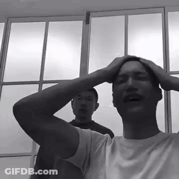 Man Holding Head In Front Of Blue Sky GIF
