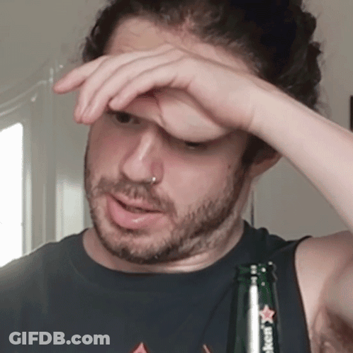 Man Holding Heineken Bottle To Forehead GIF