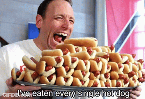 Man Holding Hot Dogs Saying I've Eaten Every Single Hot Dog GIF