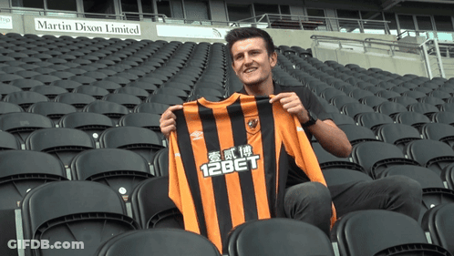 Man Holding Jersey Saying 12Bet GIF