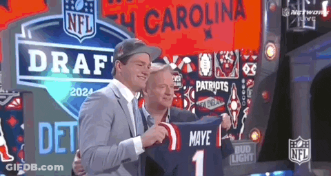 Man Holding Jersey Saying Maye 1 GIF