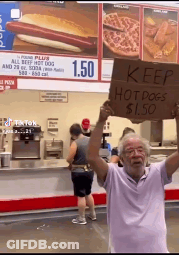 Man Holding Keep Hot Dogs $1.50 Sign GIF