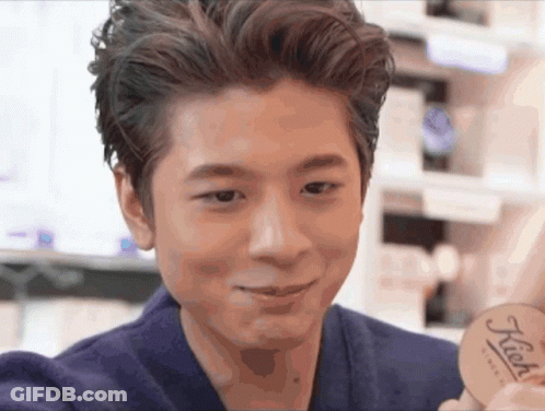 Man Holding Kiehl's Product In Front Of Face GIF