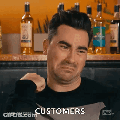 Man Holding Knife In Front Of Bar Says Customers GIF