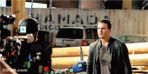 Man Holding Knife In Front Of Hamada Container GIF