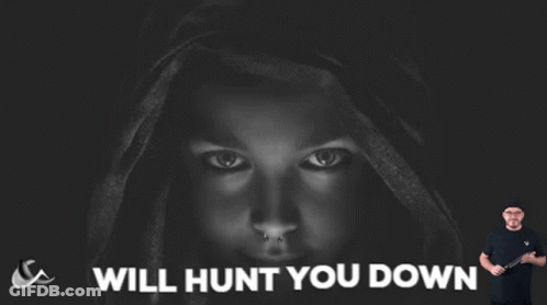 Man Holding Knife Poster Says Will Hunt You Down GIF