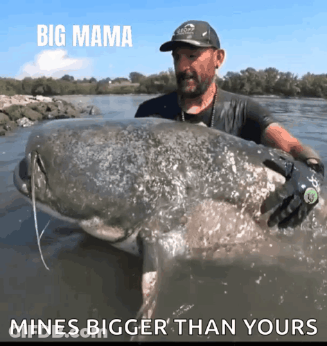Man Holding Large Fish Saying Big Mama Mines Bigger Than Yours GIF