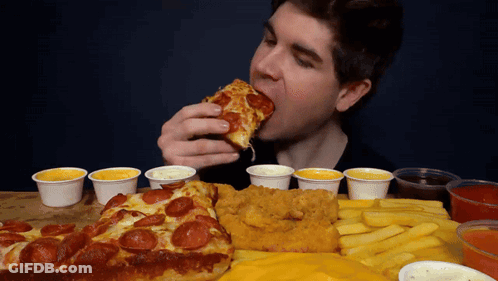 Man Holding Large Hamburger And French Fries GIF