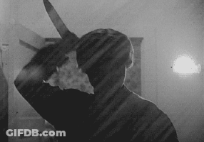 Man Holding Large Knife GIF