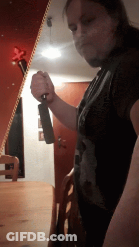 Man Holding Large Knife GIF