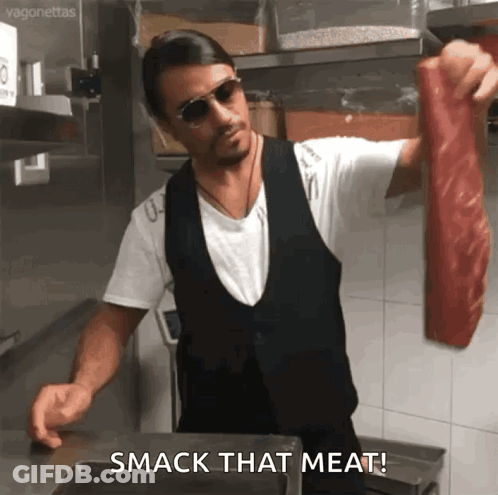 Man Holding Large Piece Of Meat GIF