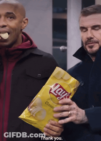 Man Holding Lays Chips While Another Eats GIF
