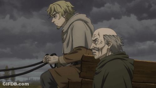 Man Holding Leash Sitting Next To Another Man GIF