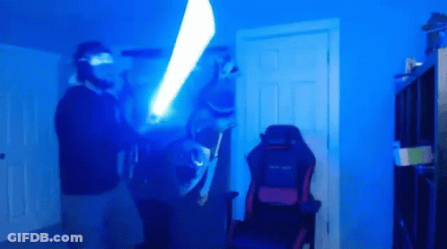 Man Holding Light Saber GIF