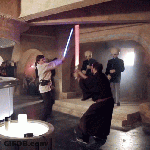 Man Holding Light Saber GIF