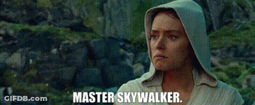 Man Holding Lightsaber In Front Of Fire Master Skywalker GIF