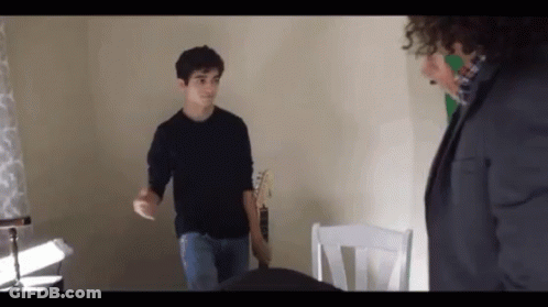 Man Holding Lit Candle Grand Cornichon GIF