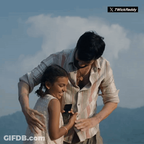 Man Holding Little Girl With Twickreddy Logo GIF