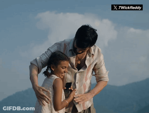 Man Holding Little Girl With Twickreddy Logo GIF