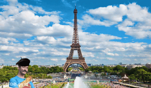 Man Holding Loaf Of Bread In Front Of Eiffel Tower GIF