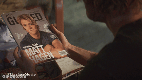 Man Holding Matt Hagen Magazine GIF