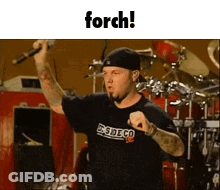 Man Holding Microphone At Drum Set Saying Forch GIF
