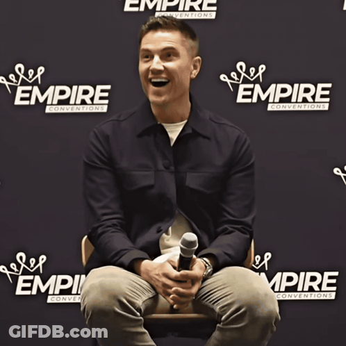 Man Holding Microphone At Empire Conventions GIF