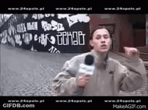 Man Holding Microphone Before Graffiti Wall Www.24opole.pl GIF