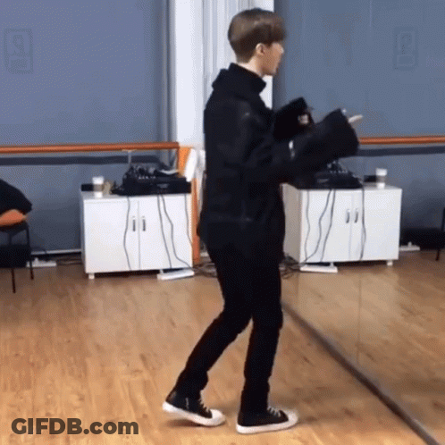Man Holding Microphone In Dance Studio Mirror GIF