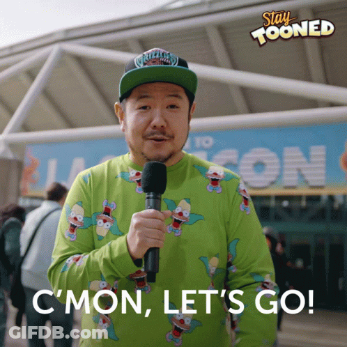 Man Holding Microphone In Front Of Stay Tooned Sign GIF