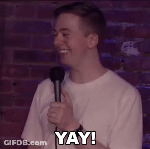 Man Holding Microphone Laughing Saying Yay GIF