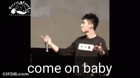 Man Holding Microphone On Stage GIF