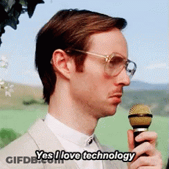 Man Holding Microphone Says Yes I Love Technology GIF