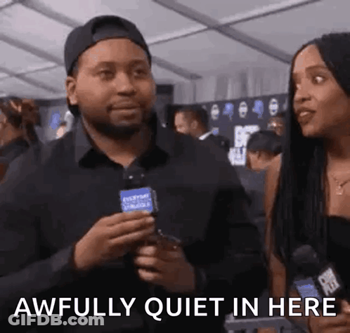 Man Holding Microphone Talking To Woman GIF