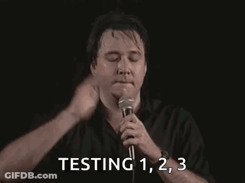 Man Holding Microphone Testing 1 2 3 GIF