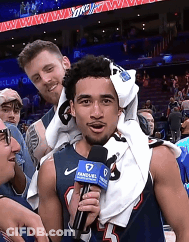 Man Holding Microphone That Says Fameuel GIF