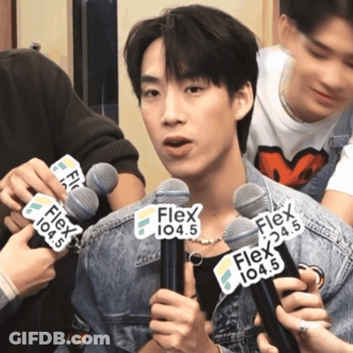 Man Holding Microphone With Flex 104.5 GIF