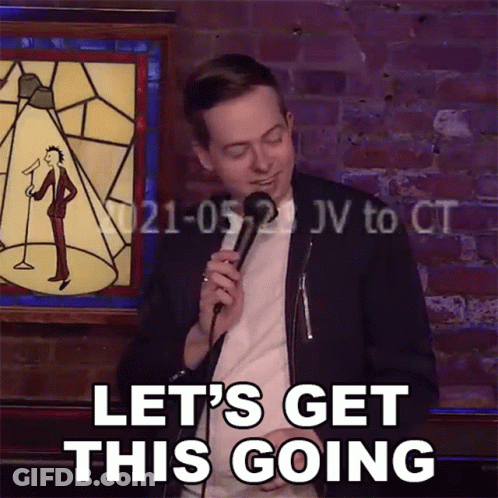 Man Holding Microphone With Let's Get This Going GIF