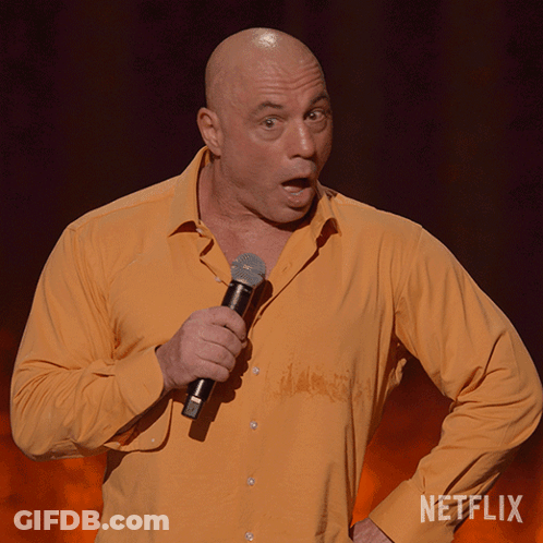 Man Holding Microphone With Netflix Logo GIF