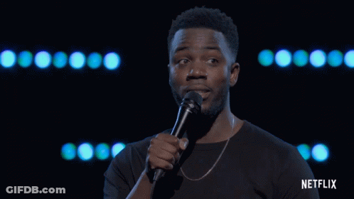 Man Holding Microphone With Netflix On Bottom GIF