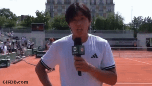Man Holding Microphone With Number 4 GIF