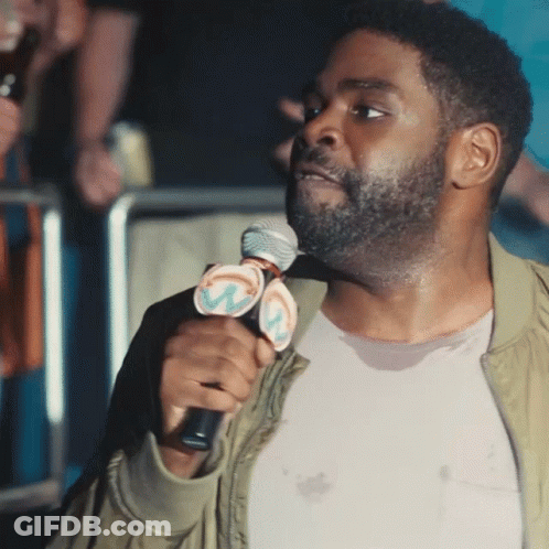 Man Holding Microphone With W GIF