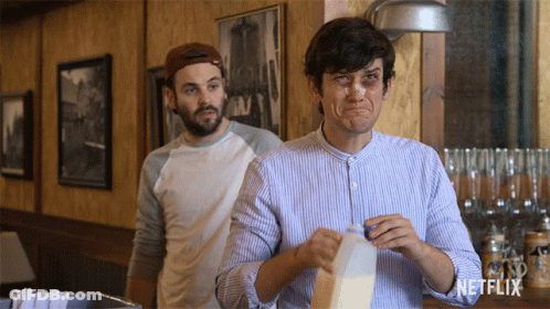 Man Holding Milk Carton With Netflix Logo GIF
