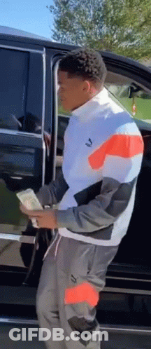 Man Holding Money Next To Car GIF