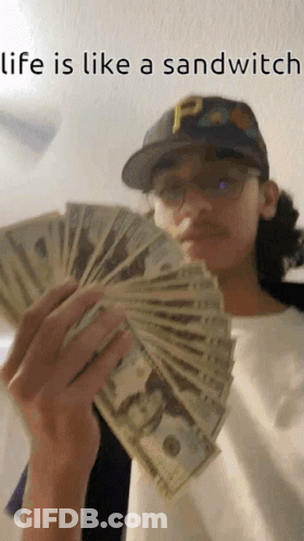 Man Holding Money Saying Life Is Like A Sandwich GIF